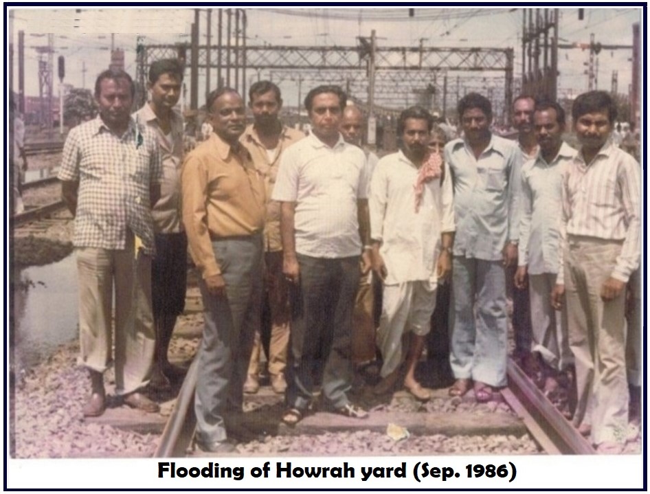 A group of men standing on railroad tracks AI-generated content may be incorrect.