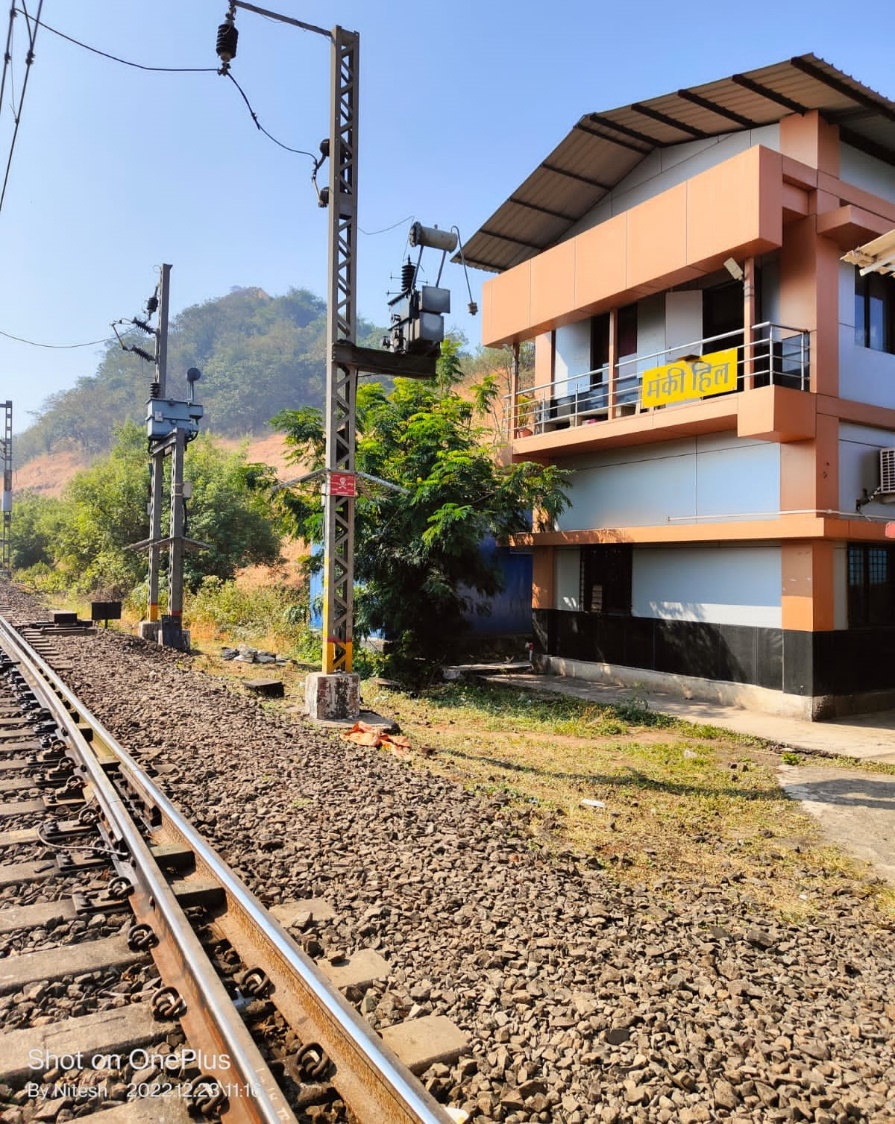 Train tracks next to a building AI-generated content may be incorrect.